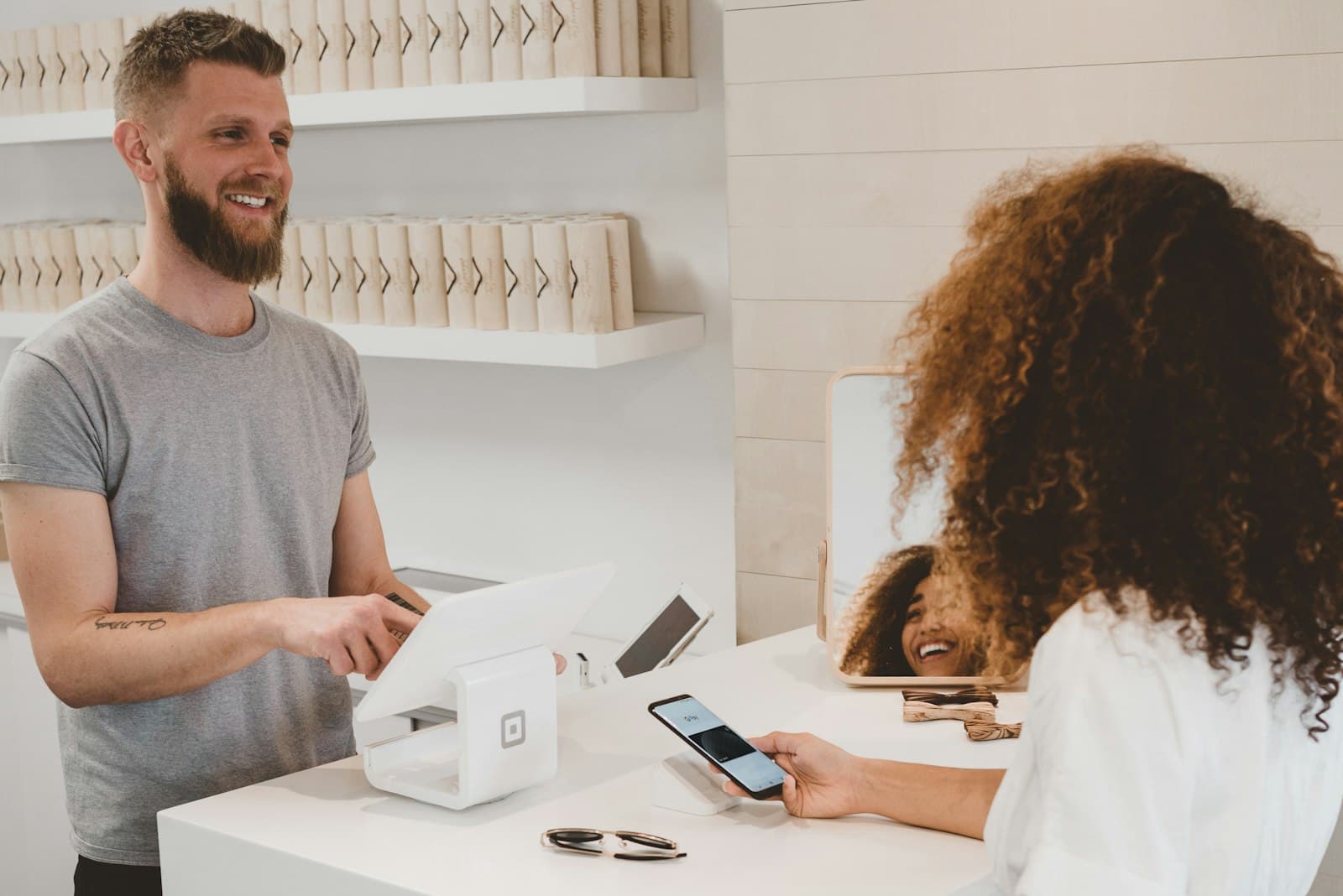 A customer checking out with a card